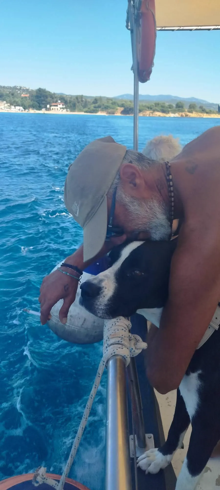 Dimitris with the dogs aboard the Fishing 4 You boat